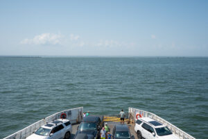 A view overlooking Delaware Bay from the lido deck of the Cape May - Lewes Ferry showing the car deck filled with vehicles crossing the Bay