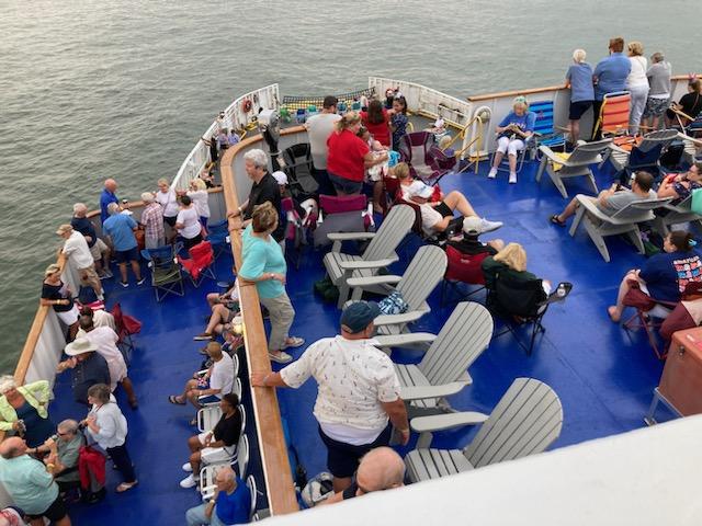 A summer crowd enjoys the weather and the view on the outside decks onboard the Cape May - Lewes Ferry
