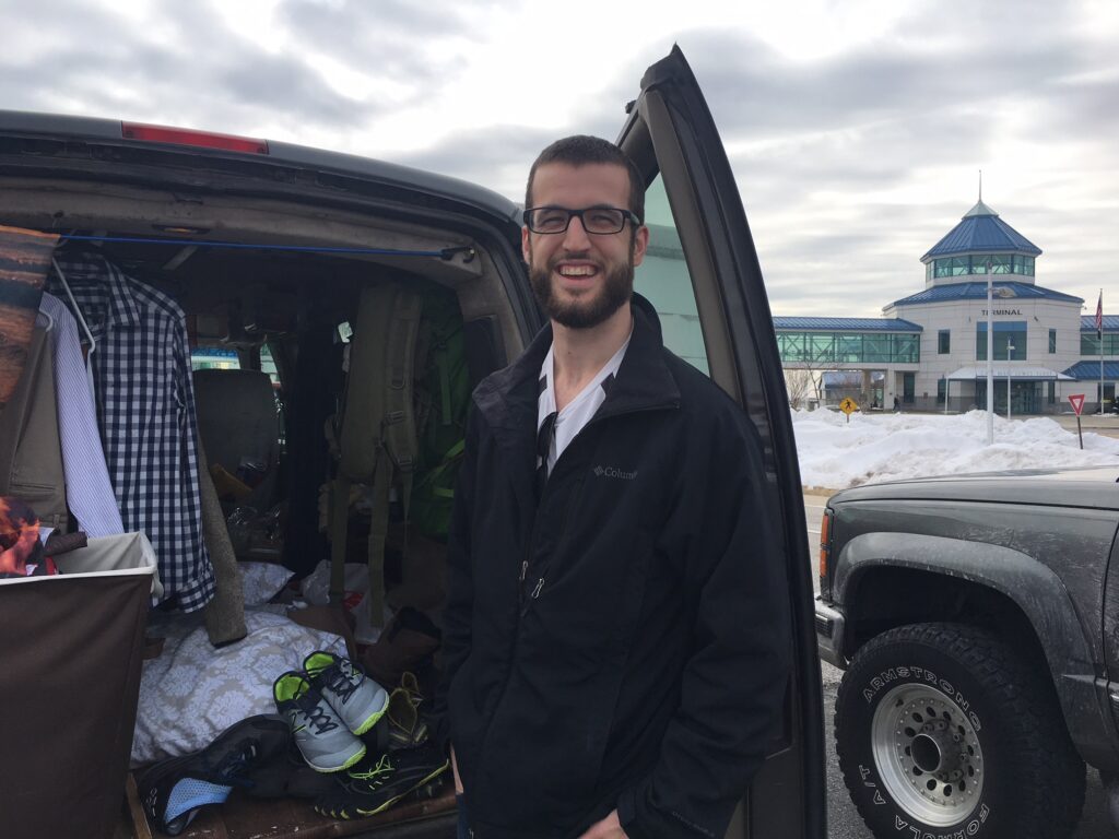 Passenger smiling during a routine vehicle inspection prior to boarding